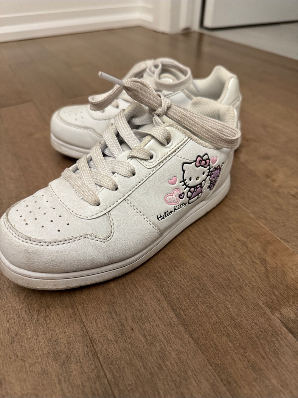 Hello Kitty White Sneakers with Pink Accents and Heart Graphic